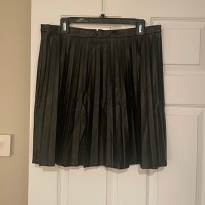A black pleated faux leather skirt
